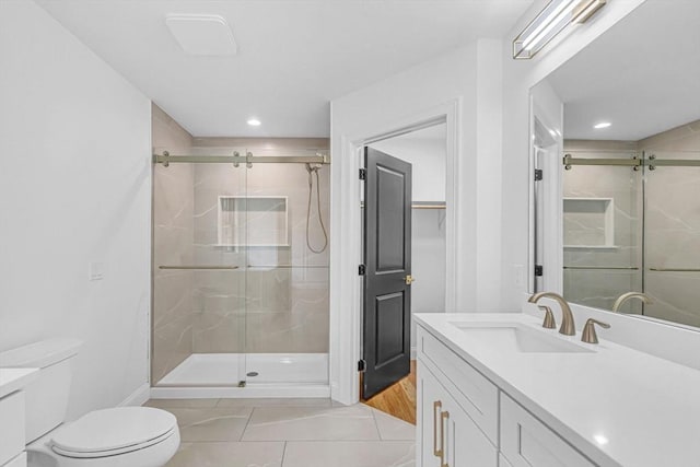 full bathroom with recessed lighting, toilet, a shower stall, and vanity