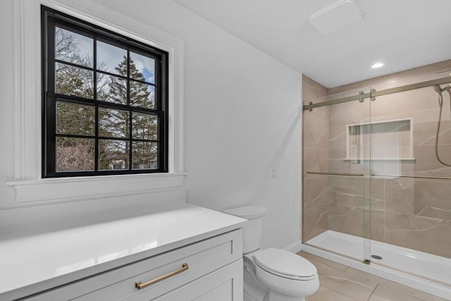 full bath with recessed lighting, a stall shower, and toilet