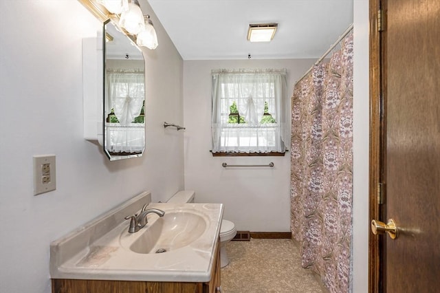 10 Corcoran Dr, Tyngsborough, MA 01879 - bathroom featuring toilet, vanity, baseboards, and a shower with shower curtain