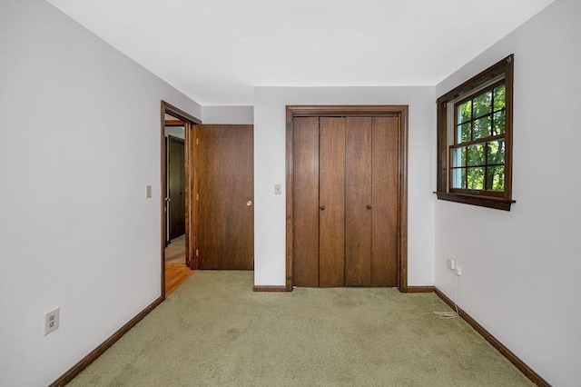 10 Corcoran Dr, Tyngsborough, MA 01879 - unfurnished bedroom featuring carpet floors, a closet, and baseboards