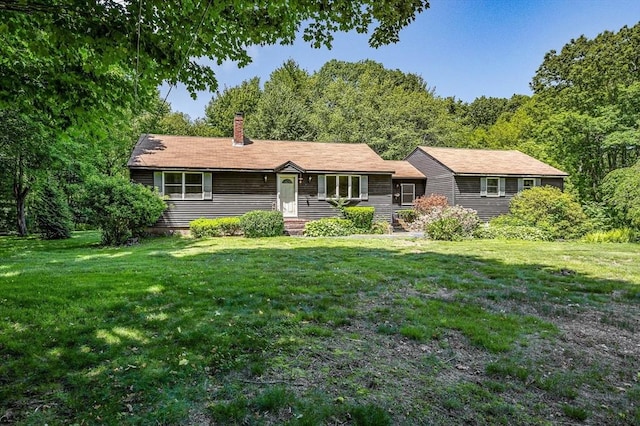 10 Corcoran Dr, Tyngsborough, MA 01879 - single story home featuring a front lawn and a chimney