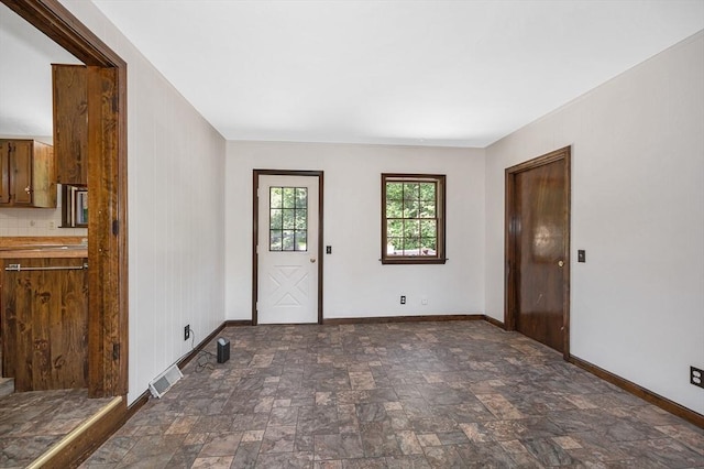 10 Corcoran Dr, Tyngsborough, MA 01879 - entryway with stone finish flooring and baseboards