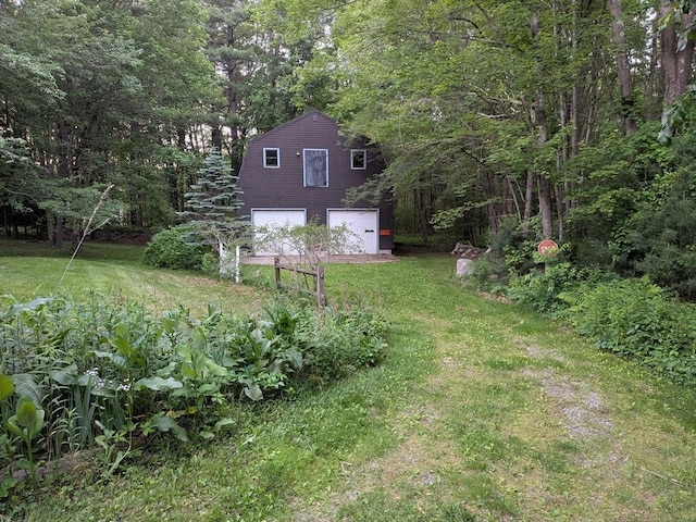 10 Corcoran Dr, Tyngsborough, MA 01879 - view of green lawn with an attached garage