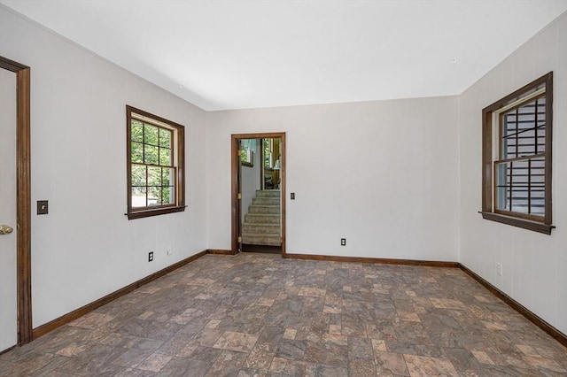 10 Corcoran Dr, Tyngsborough, MA 01879 - unfurnished room featuring stone finish floors, baseboards, and stairs