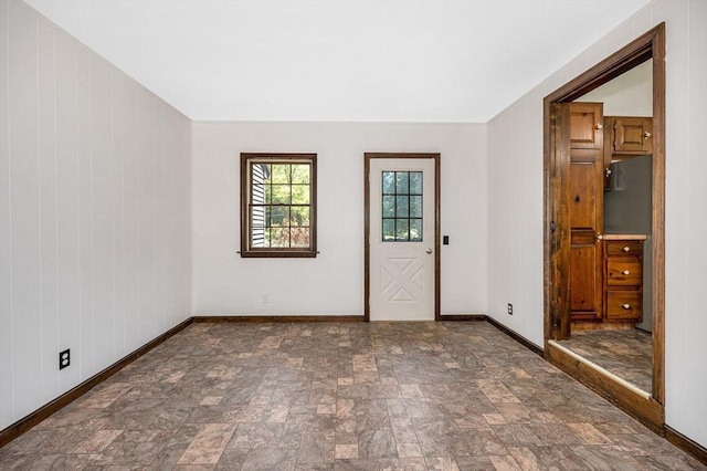 10 Corcoran Dr, Tyngsborough, MA 01879 - entryway featuring baseboards and stone finish floors