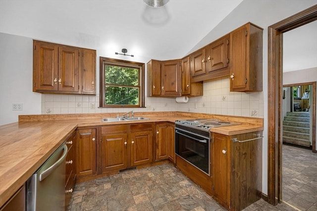 10 Corcoran Dr, Tyngsborough, MA 01879 - kitchen with butcher block counters, electric stove, a sink, dishwasher, and lofted ceiling