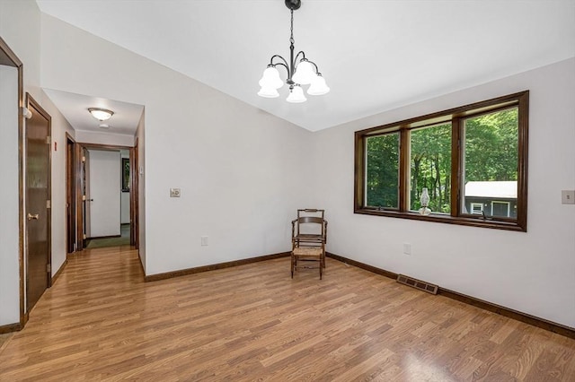 10 Corcoran Dr, Tyngsborough, MA 01879 - spare room with light wood-style flooring, a chandelier, and baseboards