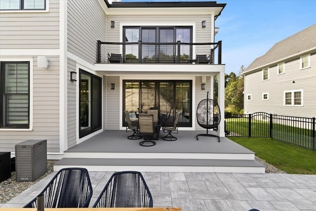 rear view of house featuring a balcony