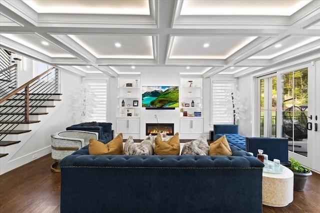 living room featuring beam ceiling, coffered ceiling, dark hardwood / wood-style flooring, and crown molding