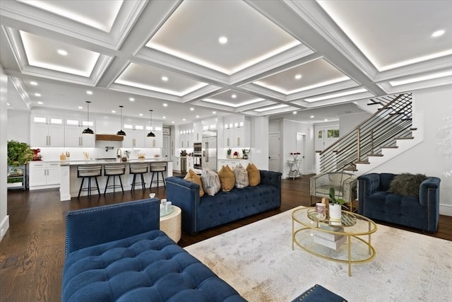 living room with beamed ceiling, coffered ceiling, and dark wood-type flooring