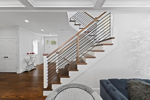 stairway featuring crown molding and wood-type flooring