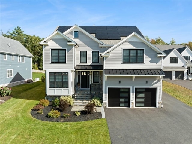 view of front facade featuring a front yard and a garage