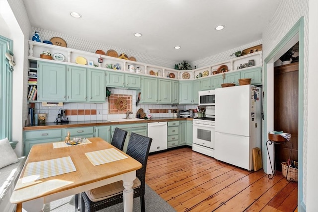 31 Mead St, Boston, MA 02129 - kitchen featuring white appliances, open shelves, recessed lighting, light wood-style floors, and decorative backsplash