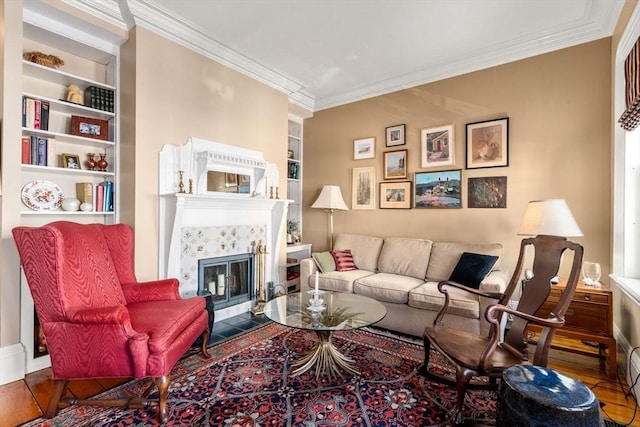 31 Mead St, Boston, MA 02129 - living area featuring crown molding, wood finished floors, built in shelves, and a fireplace