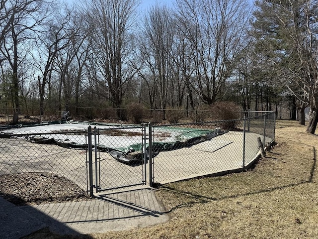 view of swimming pool featuring a gate, fence, and a fenced in pool