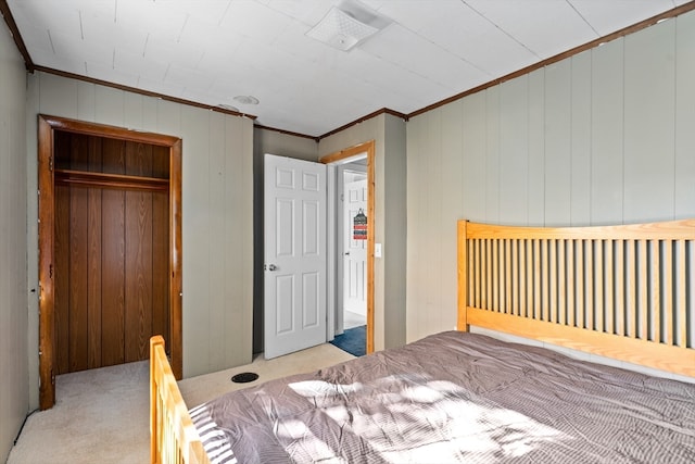 bedroom with light colored carpet, crown molding, and wood walls