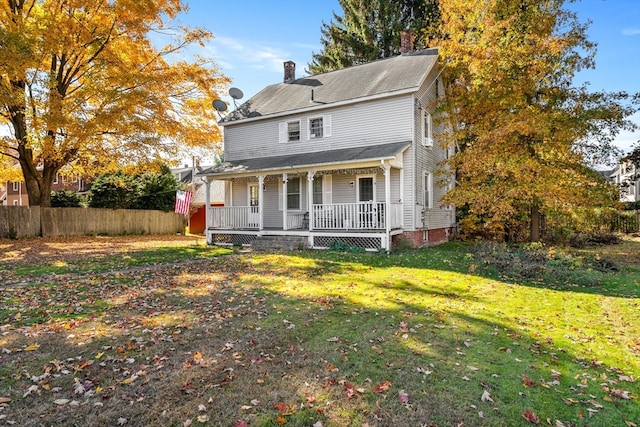 view of front of house featuring a front yard and a porch