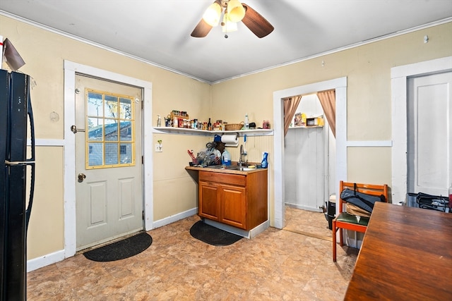 home office featuring ceiling fan and crown molding