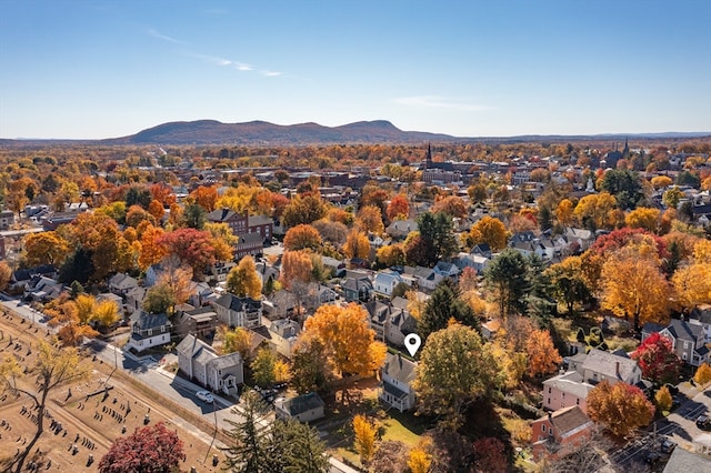 drone / aerial view featuring a mountain view