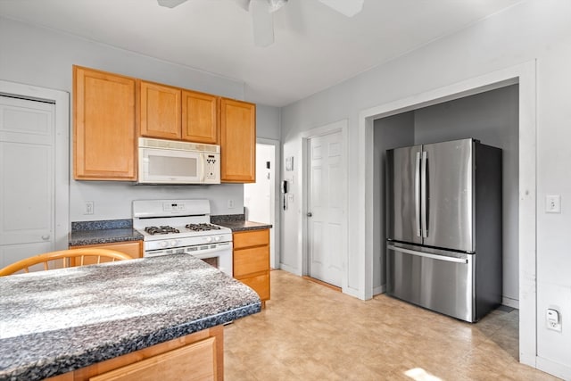 kitchen with white appliances and ceiling fan