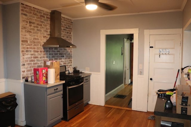 3 Moraine St, Andover, MA 01810 - kitchen featuring wall chimney range hood, stainless steel gas range, ceiling fan, crown molding, and wood finished floors
