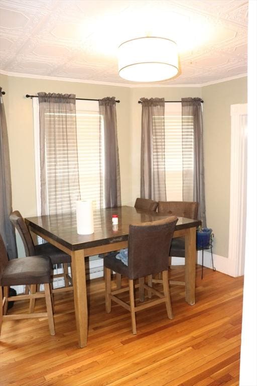 3 Moraine St, Andover, MA 01810 - dining space with light wood-style floors and ornamental molding