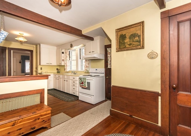 kitchen with under cabinet range hood, electric range, dark wood-style floors, beamed ceiling, and white cabinets