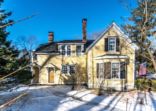 view of front of home with a chimney