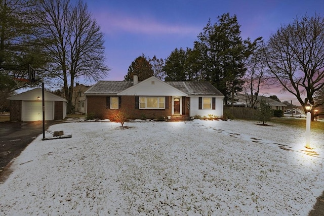 view of front of property with an outbuilding and a garage