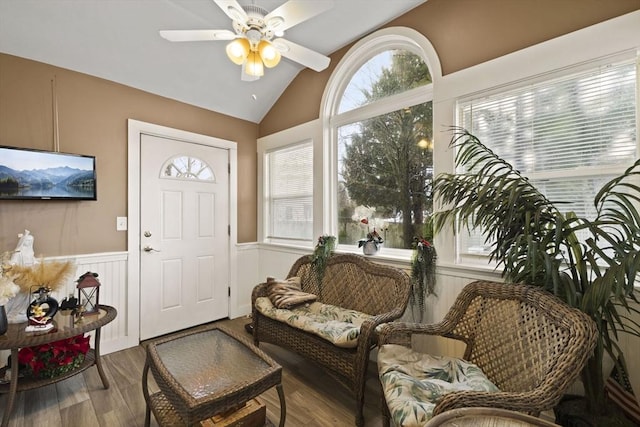 interior space featuring ceiling fan, vaulted ceiling, and hardwood / wood-style flooring