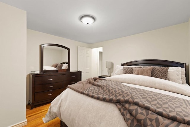 bedroom with light hardwood / wood-style floors