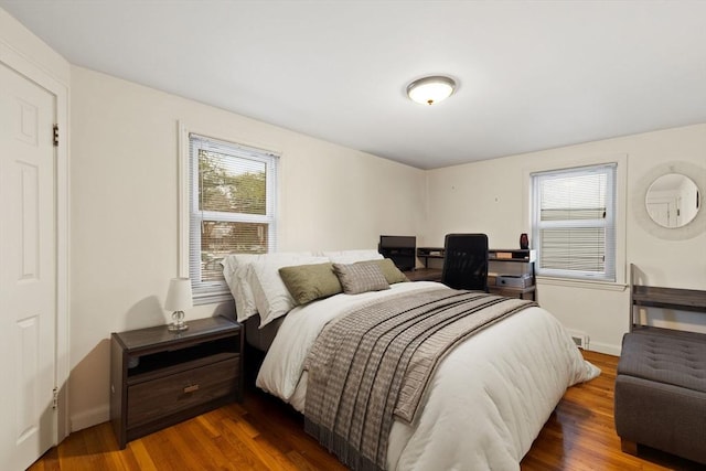 bedroom featuring dark wood-type flooring