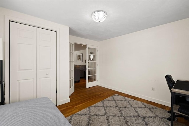 office featuring french doors and dark wood-type flooring