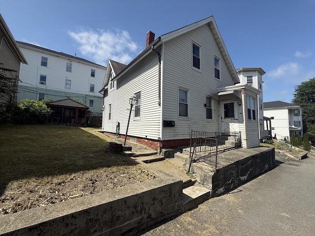 64 Suffolk St, Worcester, MA 01604 - view of property exterior featuring a chimney