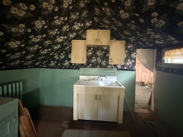 64 Suffolk St, Worcester, MA 01604 - laundry area featuring wallpapered walls, a wainscoted wall, and radiator