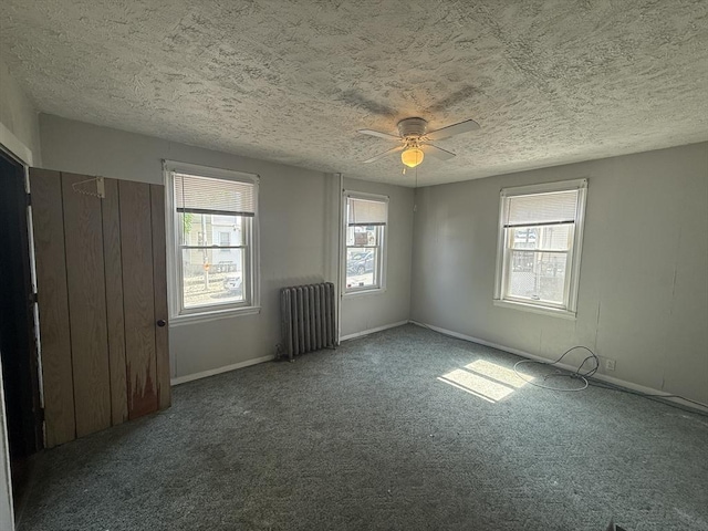 64 Suffolk St, Worcester, MA 01604 - empty room with radiator, carpet flooring, a textured ceiling, and a ceiling fan
