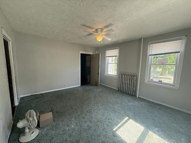 64 Suffolk St, Worcester, MA 01604 - spare room with a textured ceiling, ceiling fan, and carpet