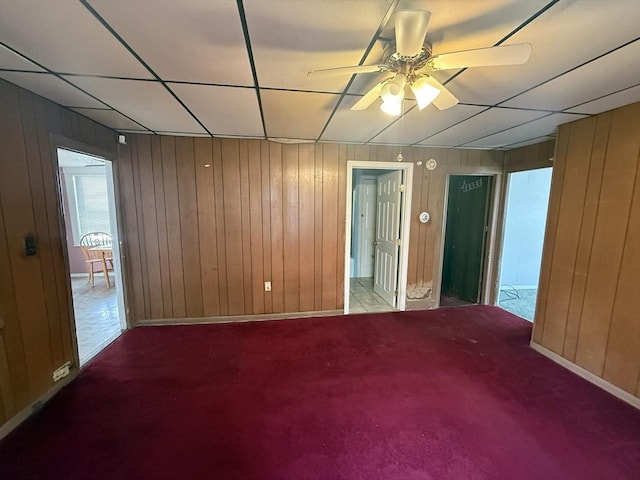 64 Suffolk St, Worcester, MA 01604 - unfurnished room with wooden walls, a ceiling fan, and carpet flooring