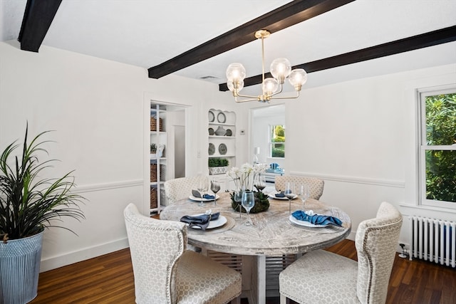 dining room featuring dark hardwood / wood-style flooring, an inviting chandelier, beam ceiling, and radiator heating unit