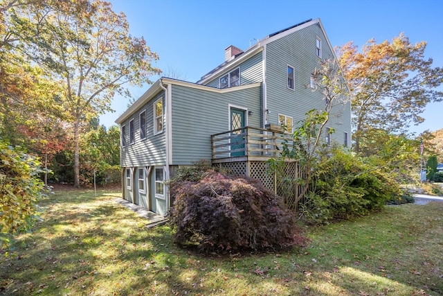 view of home's exterior with a lawn