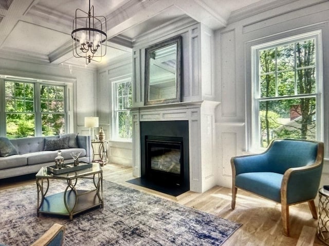 45 Widow Rites Ln, Sudbury, MA 01776 - living area with a decorative wall, coffered ceiling, wood finished floors, ornamental molding, and a chandelier