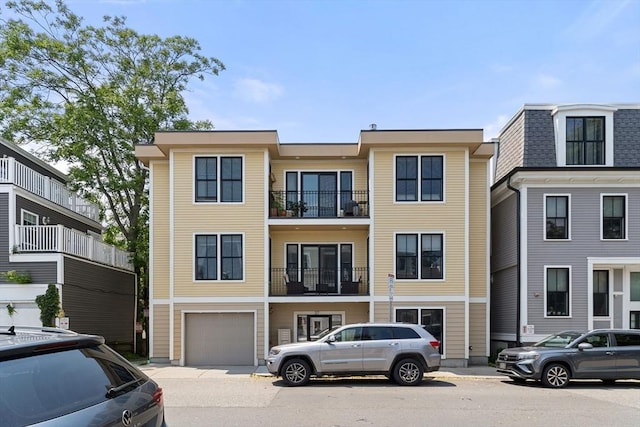37 P St Unit 2, Boston, MA 02127 - view of front of home featuring a garage and concrete driveway
