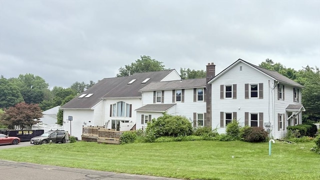 67 Amherst Rd Unit 67, South Hadley, MA 01075 - view of front of home featuring a chimney and a front lawn