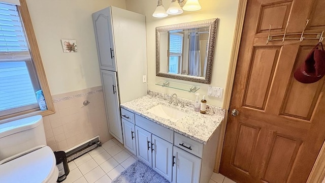 67 Amherst Rd Unit 67, South Hadley, MA 01075 - full bathroom featuring vanity, tile patterned flooring, tile walls, and wainscoting