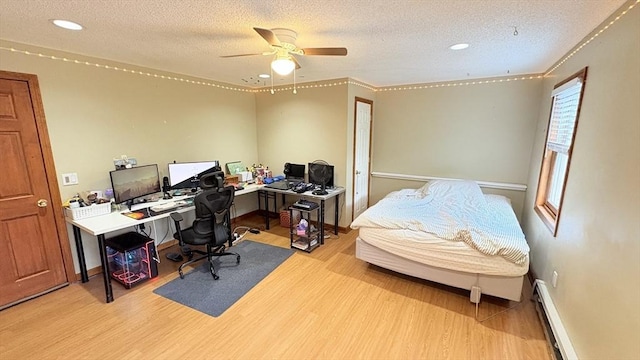 67 Amherst Rd Unit 67, South Hadley, MA 01075 - office space with a baseboard radiator, wood finished floors, a ceiling fan, a textured ceiling, and recessed lighting