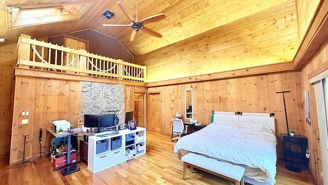 67 Amherst Rd Unit 67, South Hadley, MA 01075 - bedroom with wooden walls, wood finished floors, and high vaulted ceiling