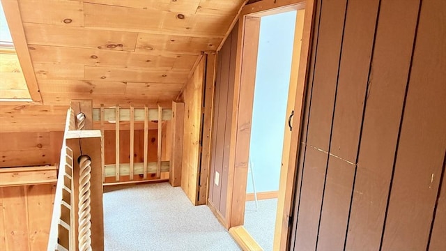 67 Amherst Rd Unit 67, South Hadley, MA 01075 - corridor featuring carpet flooring, wood ceiling, wood walls, and vaulted ceiling