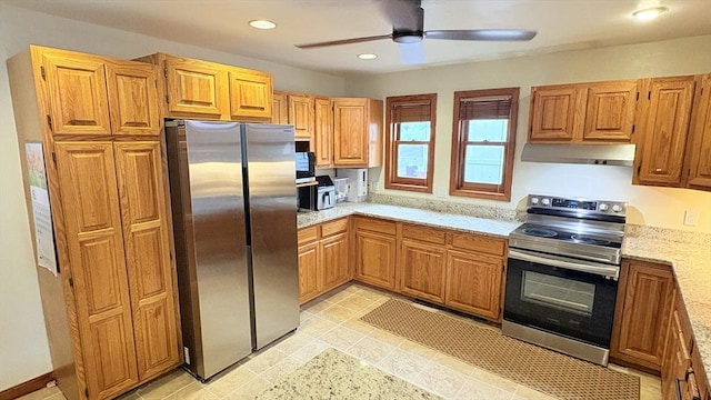 67 Amherst Rd Unit 67, South Hadley, MA 01075 - kitchen with stainless steel appliances, under cabinet range hood, a ceiling fan, light stone counters, and recessed lighting