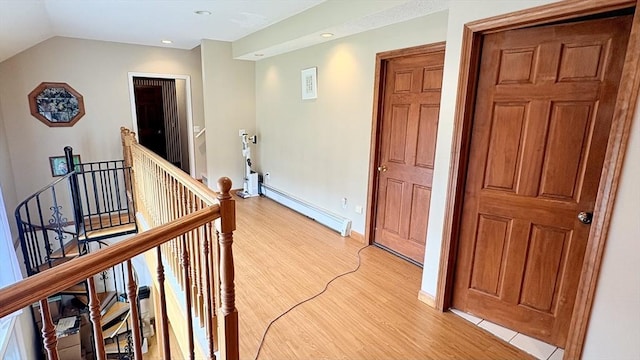 67 Amherst Rd Unit 67, South Hadley, MA 01075 - corridor featuring an upstairs landing, baseboard heating, light wood-type flooring, recessed lighting, and lofted ceiling