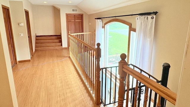 67 Amherst Rd Unit 67, South Hadley, MA 01075 - hall featuring light wood-style flooring, lofted ceiling, an upstairs landing, and recessed lighting